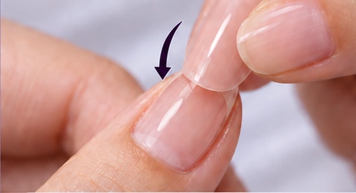 Preview of aligning a press-on nail at the cuticle