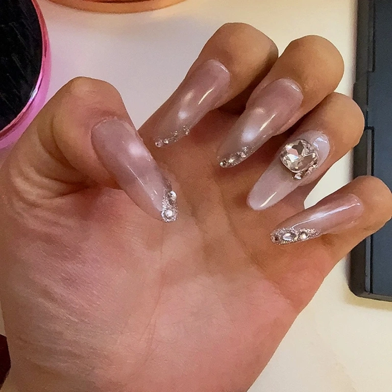 Review photo for Nude Crystal Cat Eye Medium-Length Oval Press-On Nails