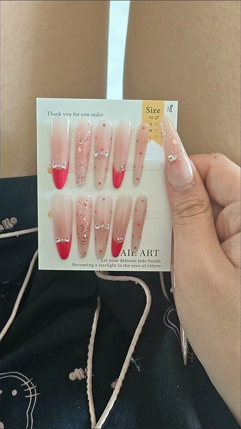 Review photo for Pink Bow French Tip Long Stiletto Press-On Nails